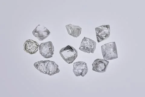 Natural rough diamonds in the sorting process close up Stock Photos