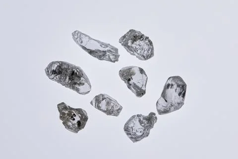Natural rough diamonds in the sorting process close up Stock Photos