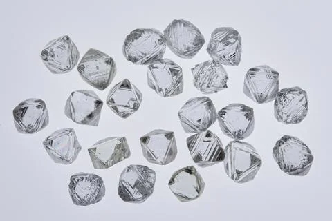 Natural rough diamonds in the sorting process close up Stock Photos