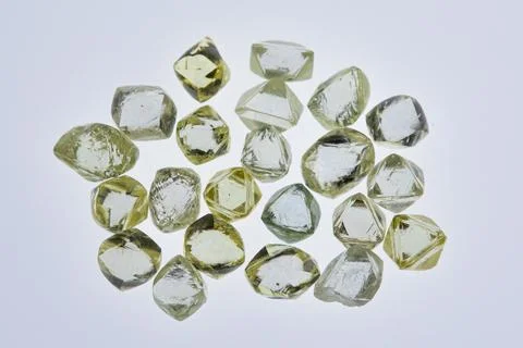 Natural rough diamonds in the sorting process close up Stock Photos