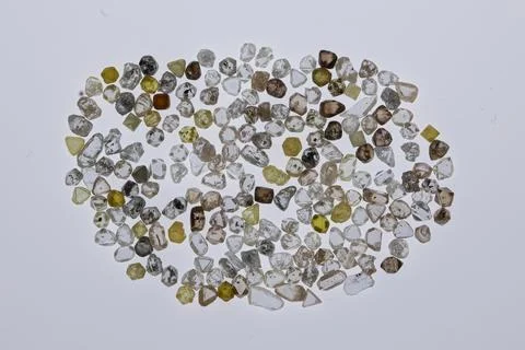 Natural rough diamonds in the sorting process close up Stock Photos