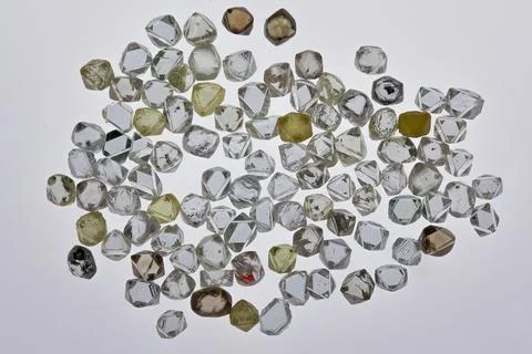 Natural rough diamonds in the sorting process close up Stock Photos