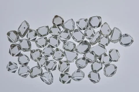 Natural rough diamonds in the sorting process close up Stock Photos