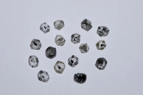 Natural rough diamonds in the sorting process close up Stock Photos