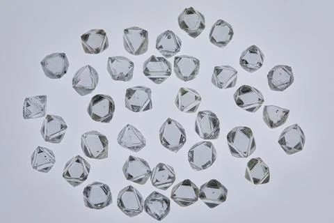 Natural rough diamonds in the sorting process close up Stock Photos