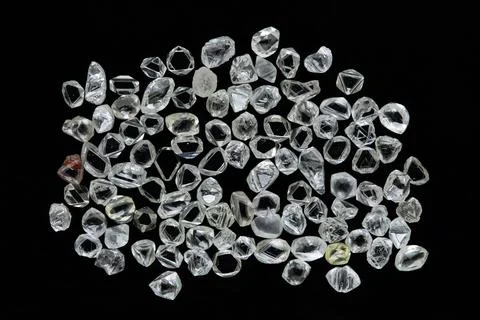 Natural rough diamonds in the sorting process close up Stock Photos