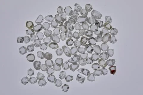 Natural rough diamonds in the sorting process close up Stock Photos
