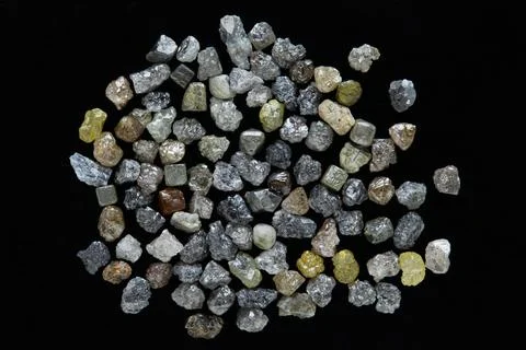 Natural rough diamonds in the sorting process close up Stock Photos