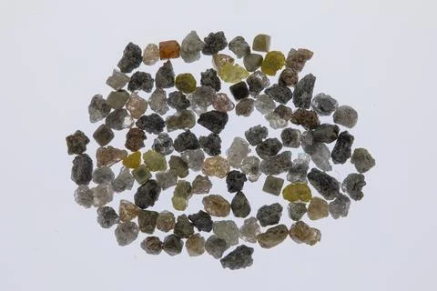 Natural rough diamonds in the sorting process close up Stock Photos