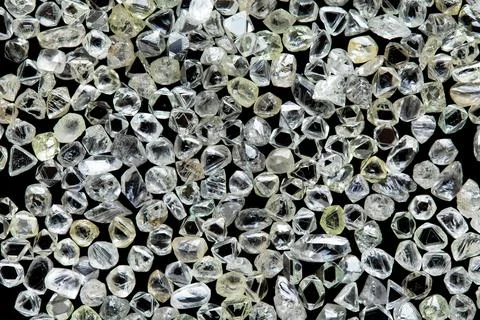 Natural rough diamonds in the sorting process close up Stock Photos