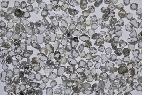 Natural rough diamonds in the sorting process close up Stock Photos