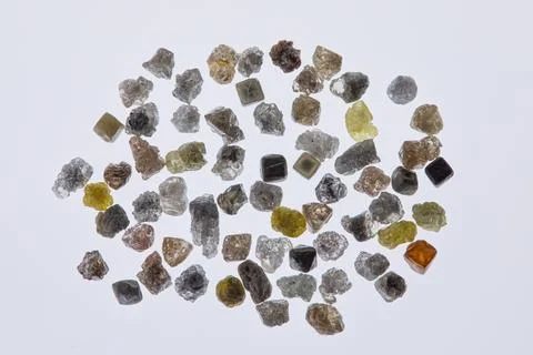 Natural rough diamonds in the sorting process close up Stock Photos