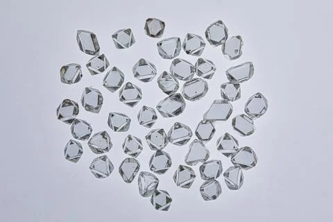 Natural rough diamonds in the sorting process close up Stock Photos