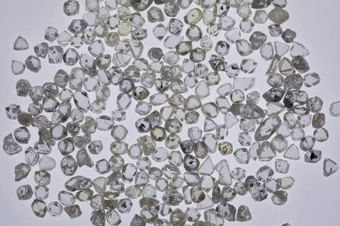 Natural rough diamonds in the sorting process close up Stock Photos