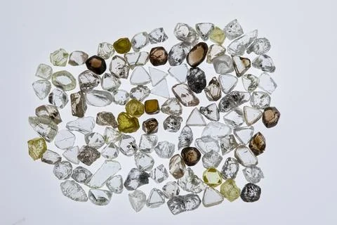 Natural rough diamonds in the sorting process close up Stock Photos