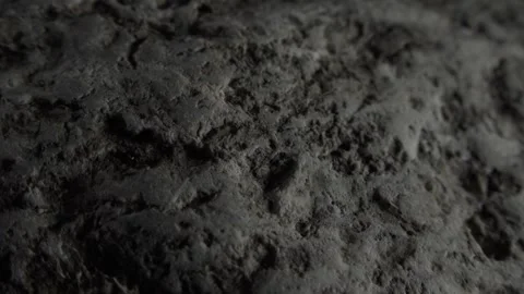 Natural Rough Surface of a Dark Rock Close-Up Stock Footage 289541545