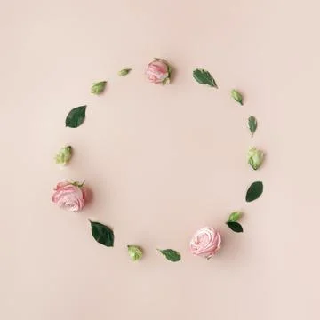 Natural round frame with copy space made of flowers and leaves Stock Photos