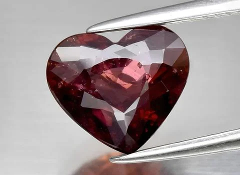 Natural ruby gem on the background Stock Photos