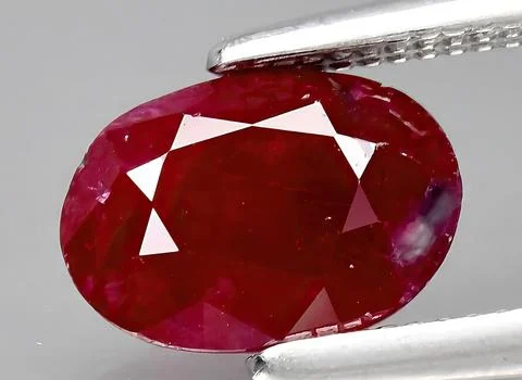 Natural ruby gem on the background 스톡 사진