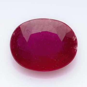 Natural ruby gem on white background Stock Photos