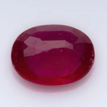 Natural ruby gem on white background Stock Photos
