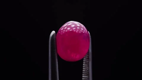 Natural ruby gemstone on the turning table Stock Footage 153019478
