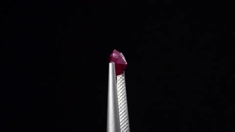 Natural ruby gemstone on the turning table Stock Footage 153019824