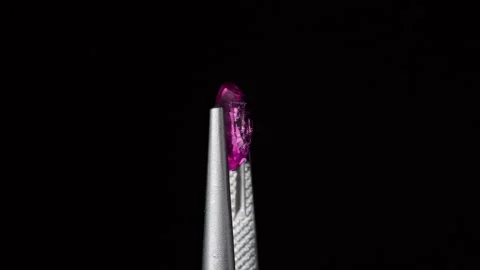 Natural ruby gemstone on the turning table Stock Footage 153019938