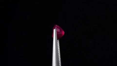 Natural ruby gemstone on the turning table Stock Footage 153020124