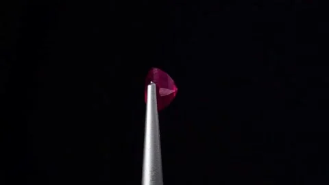 Natural ruby gemstone on the turning table Stock Footage 153020150