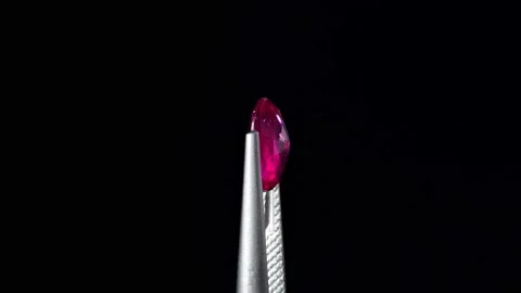 Natural ruby gemstone on the turning table Stock Footage 153020187