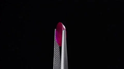 Natural ruby gemstone on the turning table Stock Footage 153020222