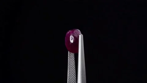 Natural ruby gemstone on the turning table Stock Footage 153020339