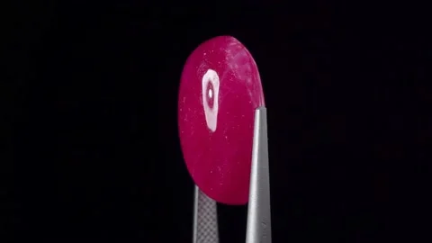 Natural ruby gemstone on the turning table Stock Footage 153021119
