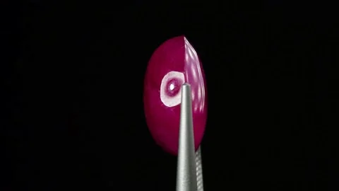 Natural ruby gemstone on the turning table Stock Footage 153021229