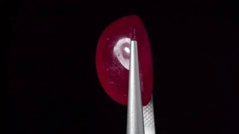 Natural ruby gemstone on the turning table Stock Footage 153021322