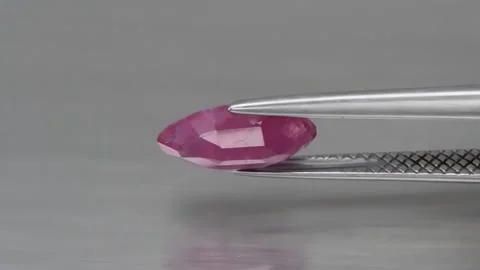 Natural ruby on gray background Stock Footage 144899440