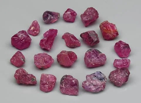 Natural ruby rough gem on the background Stock Photos