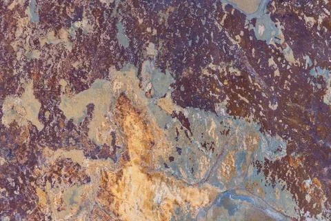 Natural rusty slate stone texture background with orange, brown, and grey colors Stock Photos