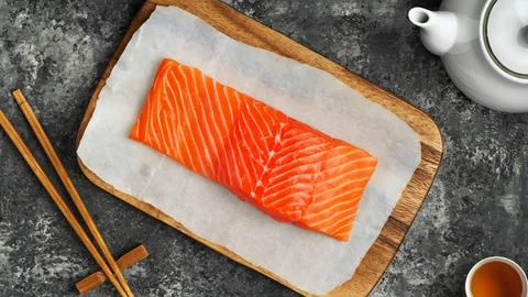 Natural salmon on a board Stock Photos
