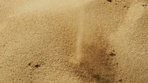 Natural sand formation captured in close-up as grains shift during a gentle Stock Footage 308302072