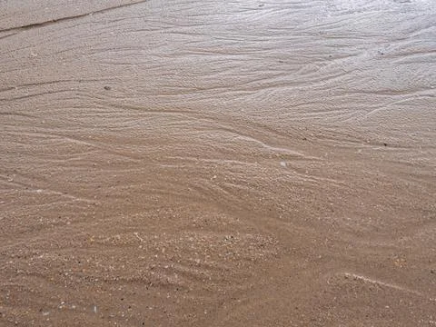 Natural sand texture background with subtle water marks on a beach Foto stock