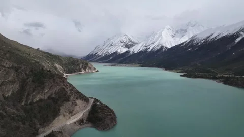 Natural scenery of the snow-capped mountains around Ranwu Lake , Tibet Stock Footage 306863073