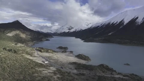 Natural scenery of the snow-capped mountains around Ranwu Lake , Tibet Stock Footage 306863637