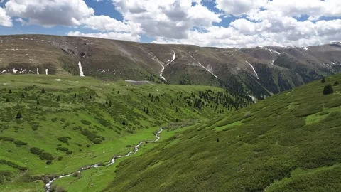 Natural scenery of snow capped mountains and grassland in Ili, Xinjiang China Stock Footage 307283653