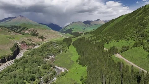 Natural scenery of snow capped mountains and grassland in Ili, Xinjiang China Stock Footage 307285232