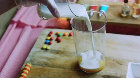 Natural serving study of homemade custard preparation on a wooden table Stock Footage 342154033