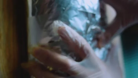 Natural serving view: unwrapping a loaded burrito Stock Footage 342168112