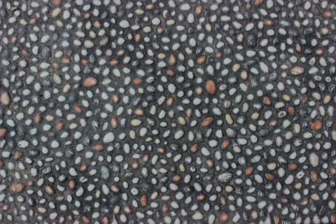 The natural, smooth texture of small, multicolored pebbles. Stock Photos