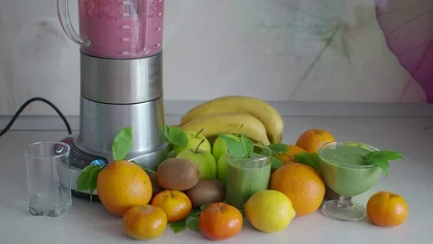 Natural smoothie blender on the kitchen table Stock Footage 75822136